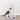 Cat playing with Trixie Junior Scratching Post against a white wall.