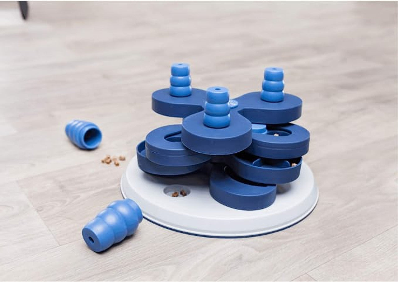 Trixie Flower Tower Strategy Game with treats on a floor, pet essentials warehouse