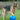 german shepherd playing with a blue boomer ball