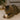 Cat playing with a small plush toy on a carpeted floor.
