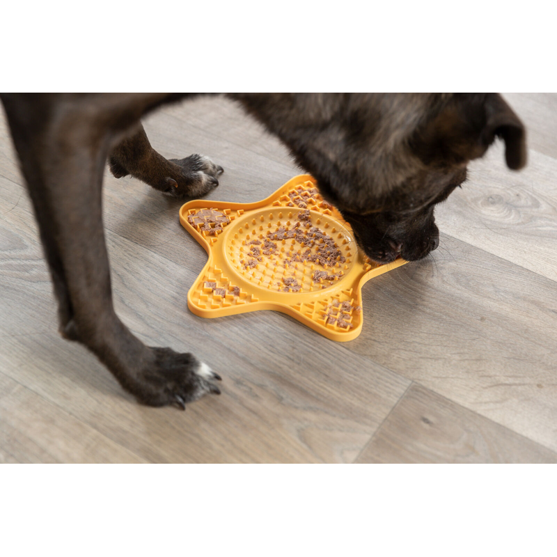 Dog eating off Trixie Lick 'n' Snack Mat silicone Yellow, trixie slow feeder, licking mat, lick mat, Pet Essentials Warehouse
