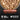 Dog food with chunks and shreds labeled 'Chunks & Shreds Salmon & Chicken Entrée' on a black background, Orijen Chunks & Shreds Salmon & Chicken Entree Wet Cat Food