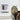 Cat sitting next to a SureFlap Microchip Connect Cat Door