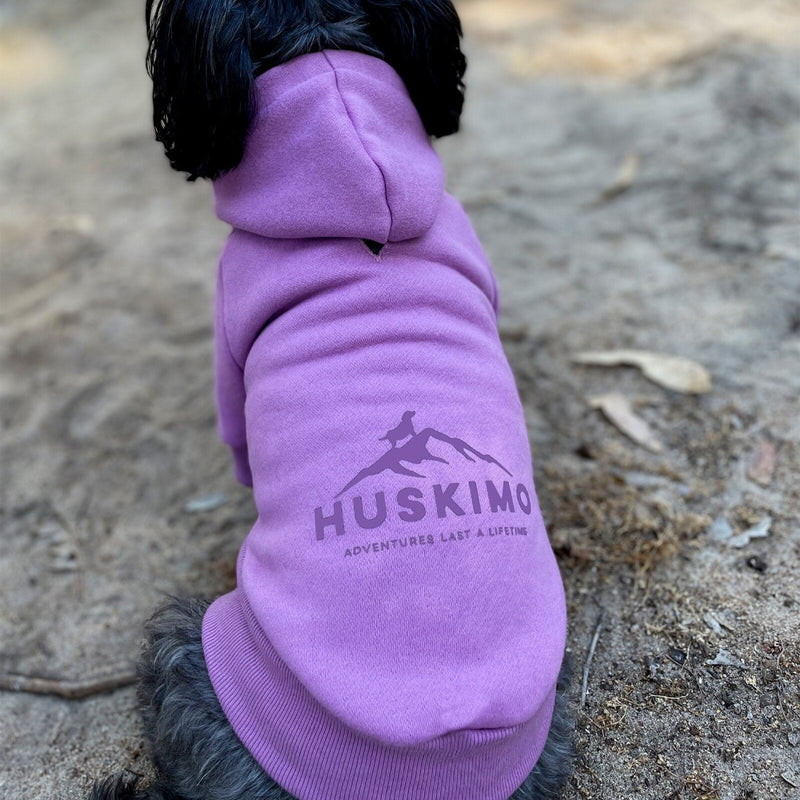 black dog wearing Huskimo Dog Coat Hartz Peak Lilac, pink huskimo dog coat, pet essentials warehouse